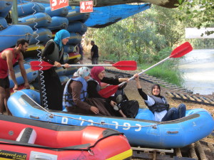 Local Moslem girls, dressed modestly, enjoy their launch onto the Jordan River.